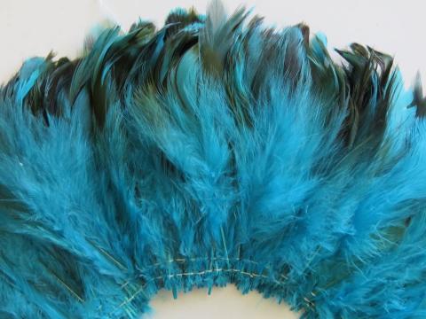 Aqua caramel cream strung schlappen feathers closeup