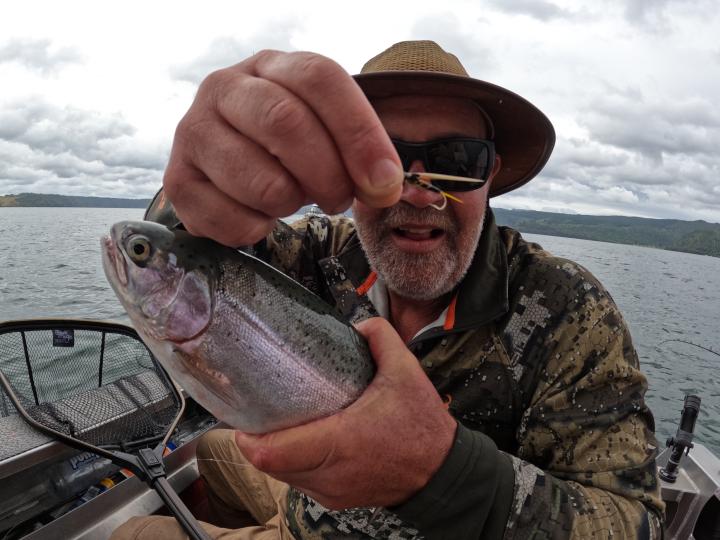 Rainbow on a Black Ghost Jigging Smelt