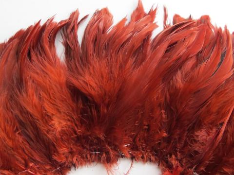 Caramel Cream Strung Feathers dyed deep red closeup