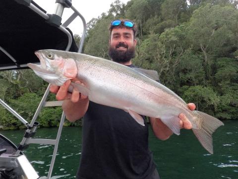 9.5 pound rainbow on a short shank grey ghost jigging smelt